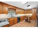 Kitchen features tile floors, granite countertops and wood cabinets at 5491 Valley Brook Road Southeast Se Rd, Mableton, GA 30126