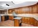 Kitchen features tile floors, granite countertops and wood cabinets at 5491 Valley Brook Road Southeast Se Rd, Mableton, GA 30126