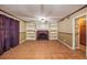 Living room with decorative brick fireplace, built-in shelving and ceramic tile floors at 5491 Valley Brook Road Southeast Se Rd, Mableton, GA 30126