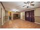 View of living room with ceramic tile floor, doors to backyard and ceiling fan at 5491 Valley Brook Road Southeast Se Rd, Mableton, GA 30126