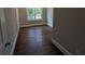 Bedroom with neutral walls, white trim, and hardwood floors at 8239 High Lake Ter, Covington, GA 30014