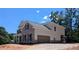 The home features a side entry garage, traditional architectural style, and a well-maintained landscape at 8239 High Lake Ter, Covington, GA 30014