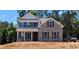 Charming two-story brick home featuring classic architectural details, dark shutters, and a well-manicured front yard at 8239 High Lake Ter, Covington, GA 30014
