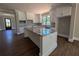 The kitchen features modern white cabinets, granite countertops, and stainless steel appliances at 8239 High Lake Ter, Covington, GA 30014