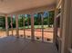 Relax on the screened porch with views of a meticulously maintained golf course and lush trees at 8239 High Lake Ter, Covington, GA 30014