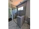 Modern walk-in shower featuring glass enclosure and gray tile at 8239 High Lake Ter, Covington, GA 30014