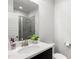 Modern bathroom features sleek vanity, white countertop, and glass enclosed shower at 914 Martin Nw St, Atlanta, GA 30315