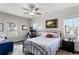 This bedroom features multiple windows with natural light, a ceiling fan, and office space at 914 Martin Nw St, Atlanta, GA 30315