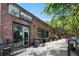 Exterior view of Monday Night Brewing, set in a renovated brick building with outdoor seating at 914 Martin Nw St, Atlanta, GA 30315