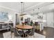 Dining area adjacent to the kitchen, showcasing modern lighting, a wooden table, and seamless flow at 914 Martin Nw St, Atlanta, GA 30315