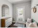 Inviting entryway with a stylish mirror, accent furniture, and natural light at 914 Martin Nw St, Atlanta, GA 30315