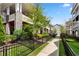 Exterior view along sidewalk with townhomes and black metal fences for each front yard at 914 Martin Nw St, Atlanta, GA 30315