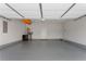Spacious garage with epoxy flooring, storage, and ample room for vehicles at 914 Martin Nw St, Atlanta, GA 30315