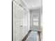 Hallway features large sliding barn door, natural light, and a decorative blue rug at 914 Martin Nw St, Atlanta, GA 30315