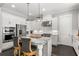 Spacious kitchen with stainless steel appliances, granite countertops, and a stylish central island at 914 Martin Nw St, Atlanta, GA 30315