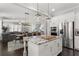 Bright kitchen with stainless steel appliances, a granite island, and easy access to the dining and living areas at 914 Martin Nw St, Atlanta, GA 30315