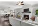 Bright, open-concept living room with a fireplace, seamlessly connected to the dining and kitchen areas at 914 Martin Nw St, Atlanta, GA 30315