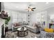Comfortable living room featuring a fireplace, L-shaped sofa, and stylish rug, creating a cozy ambiance at 914 Martin Nw St, Atlanta, GA 30315