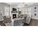 Cozy living room featuring a fireplace, plush seating, and natural light for comfortable living and relaxation at 914 Martin Nw St, Atlanta, GA 30315