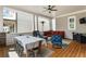 Spacious covered patio with comfortable seating, dining table, and a ceiling fan, providing a relaxing outdoor space at 914 Martin Nw St, Atlanta, GA 30315