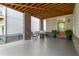Covered outdoor patio with brick columns, comfortable seating, and access to the backyard at 914 Martin Nw St, Atlanta, GA 30315