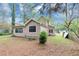 Home's exterior with backyard featuring large windows and well-maintained lawn at 916 Forest Pointe Way, Jonesboro, GA 30238