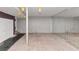 Spacious basement featuring neutral carpet, drop lighting, wall mirrors, and closet doors at 916 Forest Pointe Way, Jonesboro, GA 30238