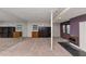 Large finished basement featuring carpeted flooring, dark cabinets, and accent lights at 916 Forest Pointe Way, Jonesboro, GA 30238