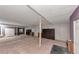 Spacious basement with carpet, a full mirror wall, and built-in cabinets at 916 Forest Pointe Way, Jonesboro, GA 30238