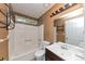 This clean bathroom has a shower-tub combo, vanity sink, and mosaic tile accents at 916 Forest Pointe Way, Jonesboro, GA 30238
