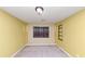 Bedroom with yellow walls and carpeted flooring at 916 Forest Pointe Way, Jonesboro, GA 30238