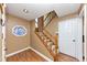 Inviting entryway with wood floors, stairs to the second floor, and a stained glass window adding charm at 916 Forest Pointe Way, Jonesboro, GA 30238