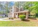 Inviting two-story home with well-kept lawn, integrated garage, and a covered front porch at 916 Forest Pointe Way, Jonesboro, GA 30238
