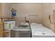 Functional laundry room with a washer, dryer, and water heater at 916 Forest Pointe Way, Jonesboro, GA 30238
