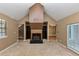 Cozy living room featuring a fireplace, built-in bookshelves, and sliding doors to the exterior at 916 Forest Pointe Way, Jonesboro, GA 30238