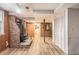 Basement with a brick fireplace, wood paneling, and stairs at 3431 Alcan Way, Tucker, GA 30084