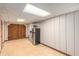 Finished basement featuring wood paneling, refrigerator and barn doors at 3431 Alcan Way, Tucker, GA 30084