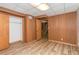 Finished basement with wood paneled walls and closet at 3431 Alcan Way, Tucker, GA 30084