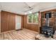 Basement featuring brick fireplace, wood paneling and exterior access at 3431 Alcan Way, Tucker, GA 30084