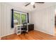 Bright bedroom with hardwood floors, a window, and panelled walls at 3431 Alcan Way, Tucker, GA 30084