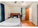 Bedroom features a bed, window with dark curtains, a ceiling fan, and hardwood floors at 3431 Alcan Way, Tucker, GA 30084