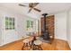 Cozy breakfast nook with a charming wood-burning stove and access to the outdoors at 3431 Alcan Way, Tucker, GA 30084