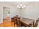 Cozy dining area featuring hardwood floors and ample natural light, flowing seamlessly into the kitchen at 3431 Alcan Way, Tucker, GA 30084