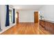 Bright living room with hardwood floors, vintage cabinet and accent lamp at 3431 Alcan Way, Tucker, GA 30084