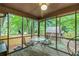 Relaxing screened porch with outdoor seating overlooking backyard at 3431 Alcan Way, Tucker, GA 30084