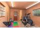 Interior view of the shed including workout equipment and a storage area at 3431 Alcan Way, Tucker, GA 30084