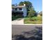 Charming two-story home with vinyl siding, a driveway, and a partially fenced yard at 3503 Ten Oaks Court Ct, Powder Springs, GA 30127
