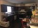 Functional kitchen featuring dark cabinetry, countertops and appliances at 3503 Ten Oaks Court Ct, Powder Springs, GA 30127