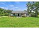 Charming home with a cozy front porch and well-kept lawn at 3517 Plunkett Rd, Stonecrest, GA 30038