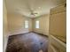 Spacious bedroom featuring two windows, original wood flooring, and ample natural light, awaiting personalization and updates at 3517 Plunkett Road Rd, Stonecrest, GA 30038